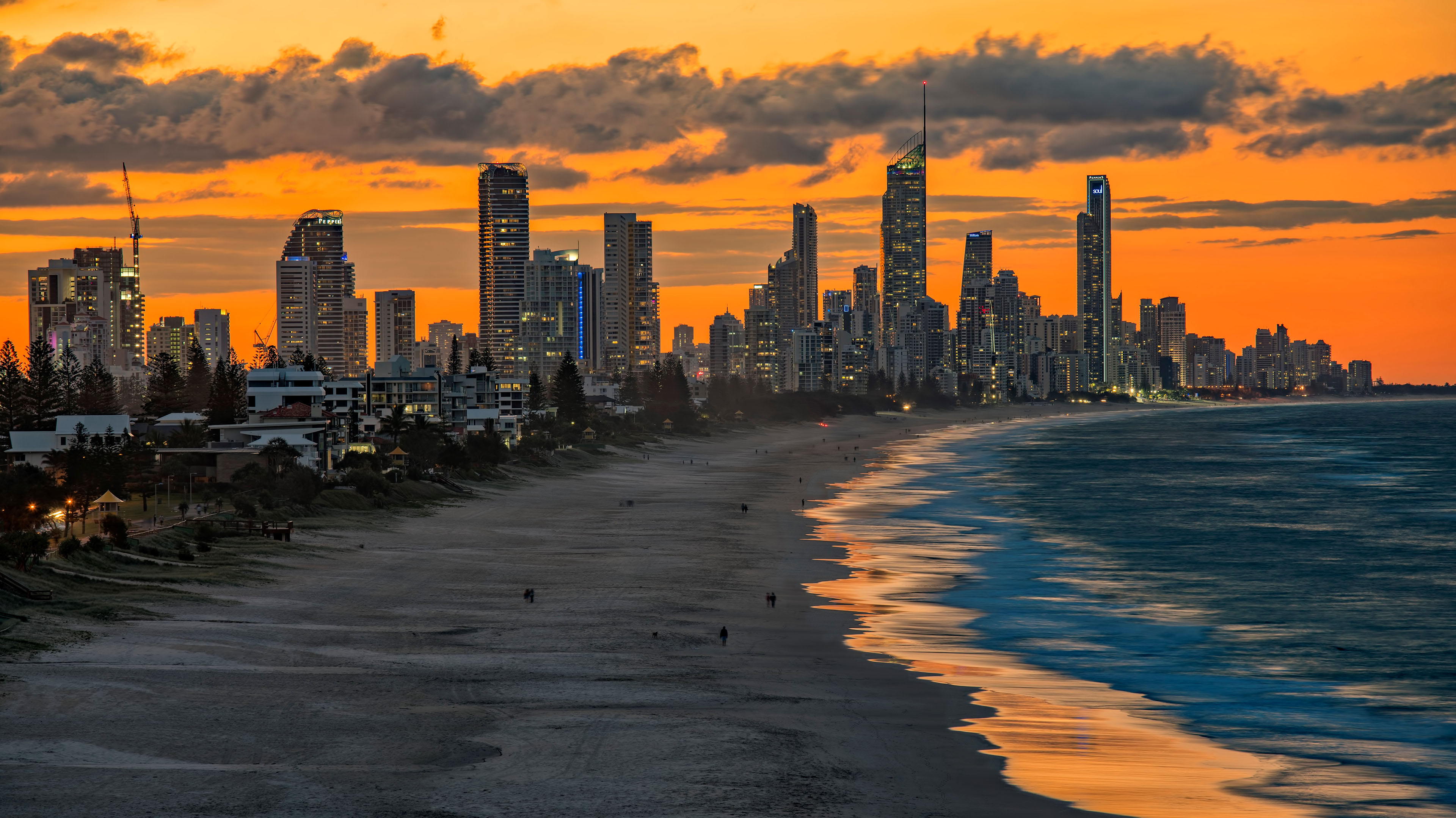 城市夜景,落日余晖,海滩,海浪,海滨城市,晚霞